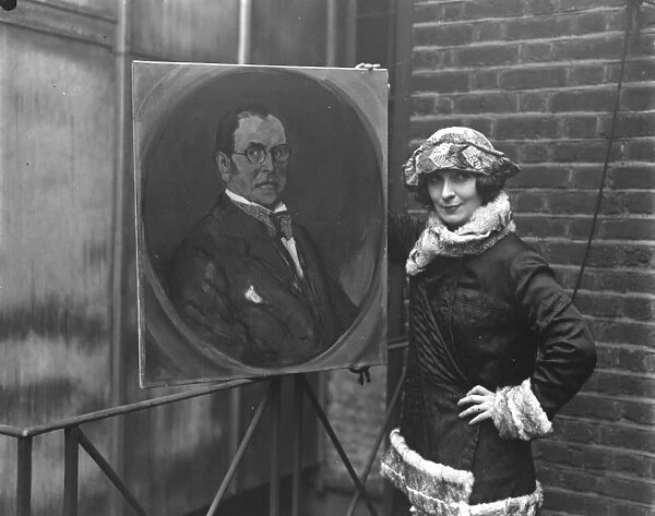 Lady Lavery with her painting of Sir John Lavery 1923