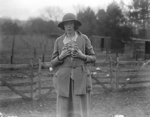 Lady Rosabelle Brand with ducklings on her duck farm at Littledene near Lewes, Sussex