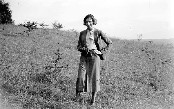 Lady walking in the countryside. 1933