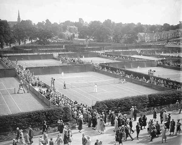 Lawn tennis at Wimbledon. A panoramic view showing play in progress on the courts