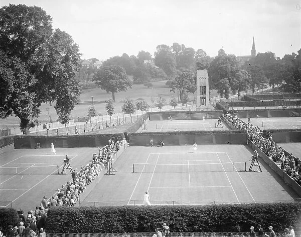Lawn tennis at Wimbledon. A panoramic view showing play in progress on the courts