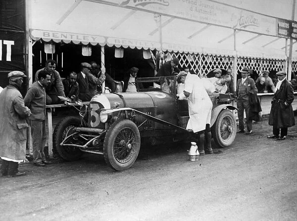 Le Mans 1927 Old Number 7 3 litre Bentley at the pits being refilled by Dr J D Benjafield