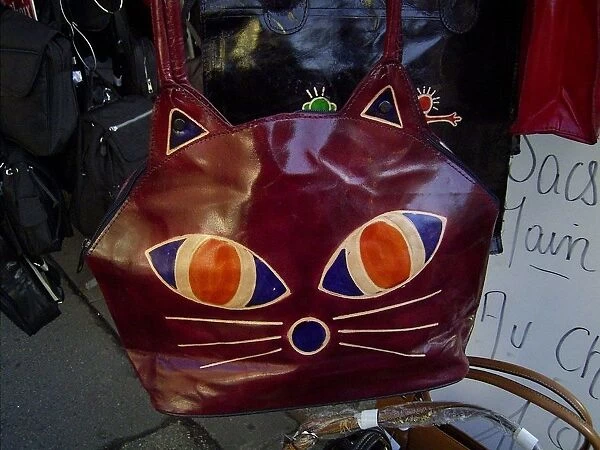 Leather bag decorated with motif of a cats face, market stall, Dieppe, Seine-Maritime