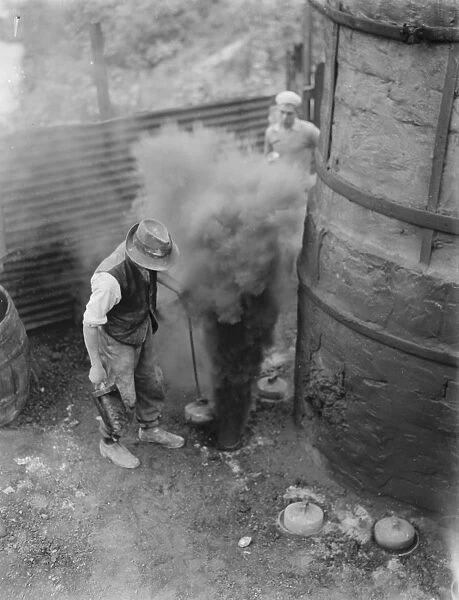 The Lime works in Dunton Green, Kent. Workers stoke the fires in the kilns