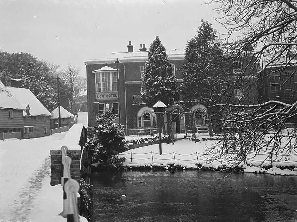 The Lion pub in Farningham, Kent, viewed from over the river Darent