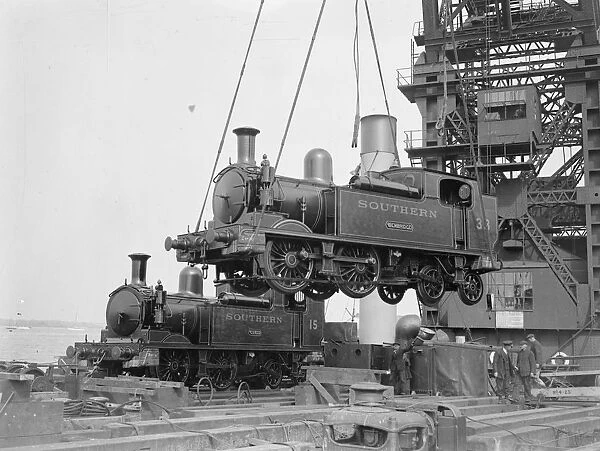 Loading two railways engines by the 150 ton floating crane for the Isle of Wight holiday rush
