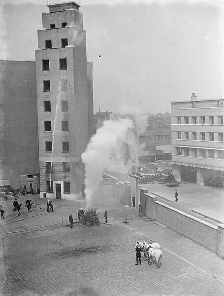 A London Fire Brigade display in Lambeth, London. Fire crew use a steam-powered