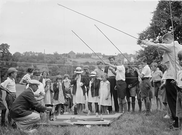 Longfield fete near Dartford, Kent. Children play traditional rod and magnet game