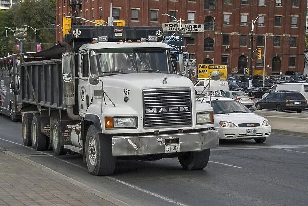 Mack 8 wheeled rigid tipper truck in down town Toronto traffic