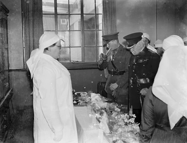 Major M J Malling and Colonel Rje Oliver tasting fruits while at demonstration overlooking