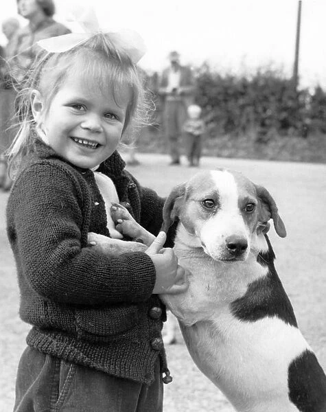 Making friends Virginia Holgate of Fairseat Kent with Patch one of Bolebroke Beagles 1958
