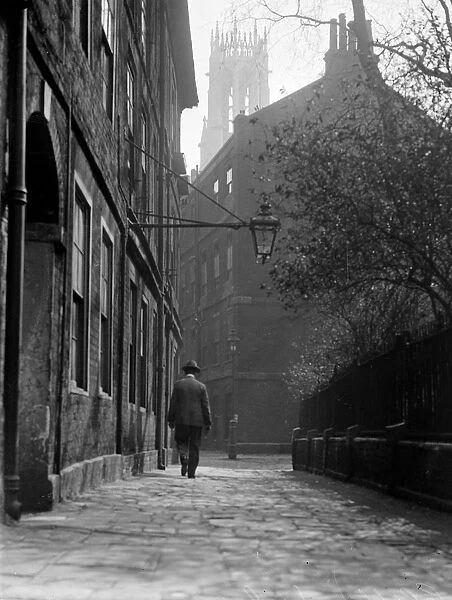 A man walking in the corner of Cliffords Inn, Middle Temple, Inns Of Court, London