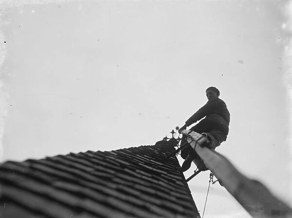 Man working up on the steeple of North Cray Church, Kent. 1936