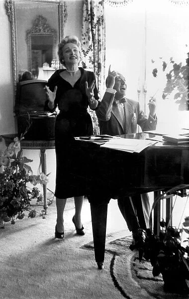 Marlene Dietrich and Noel Coward rehearsing in the Dorchester Hotel, Park Lane, London