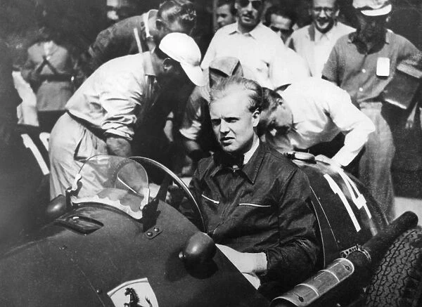 Mike Hawthorn at the wheel of his Ferrari in the pits here when he competed in the