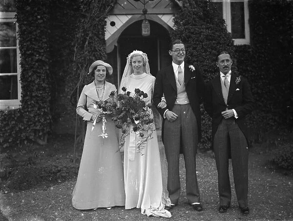 The Miles and Crabb wedding at Orpington, Kent. The bride and groom with the bridesmaid
