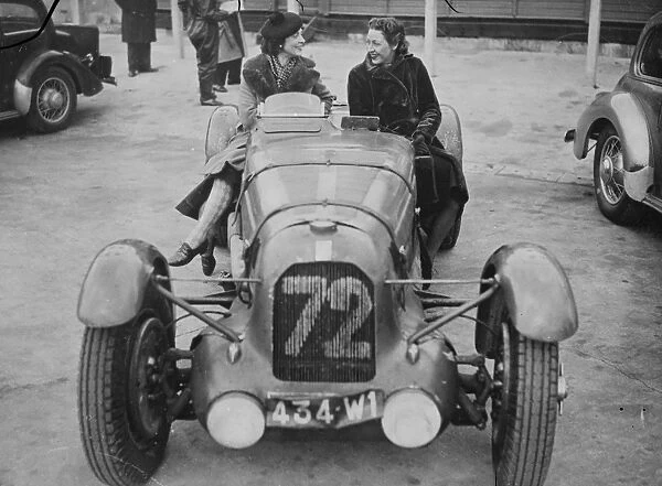 Miss Amy Johnson on the car racing track. Preparing for French trial. Miss Amy Johnson