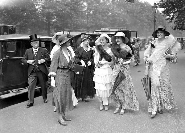 Miss Briget Thomas (centre in white) with other guests arriving for the Royal Garden
