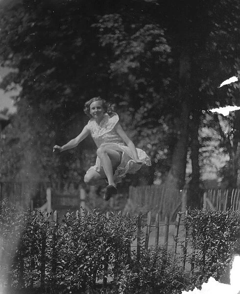 Miss D Topham jumping. 1935
