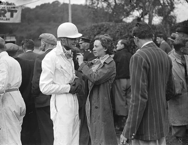 Miss Doreen Evans assists her brother K D Evans who drove an MG with her helmet before the climb