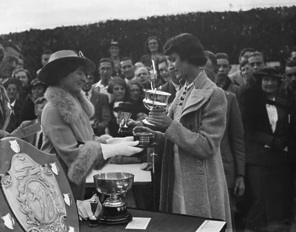 Miss E M Denney is presented with a trophy at the Miller Hospital lawn tennis competition