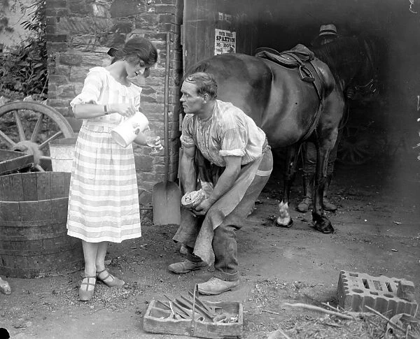 Miss Edna Maude, the seventeen year old dancer on holiday - giving the blacksmith