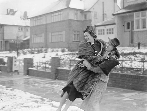 Miss Muriel Oxford is carried over the snow by a young man. 1937