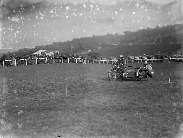 Motor cycling races at Brands Hatch A side car bike takes a corner during the race 1936