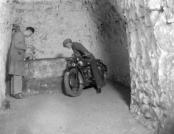 Motorcycle in caves at Chislehurst, Kent. Mushroom growing. 1934