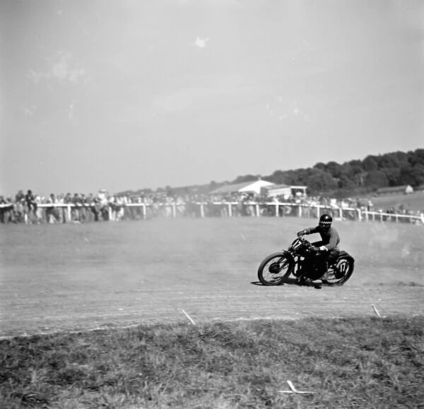 Motorcycle racing at Brands Hatch, Kent. A motorbike takes a corner