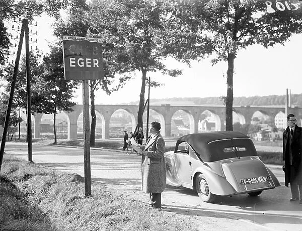 A motorist looking at the sign at the entrance to the town of Eger, the Sudetenland Storm Centre