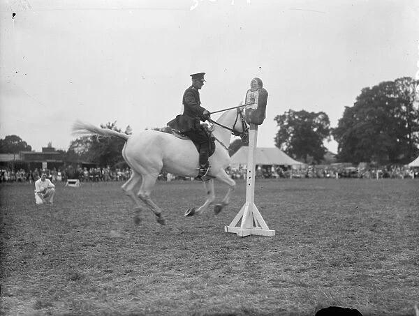 A mounted policeman competing in the truncheon event at the Metropolitan