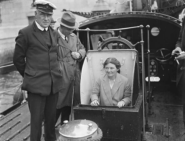 MPs inspect lifeboats off the House of Commons. Miss Margaret Bondfield, MP