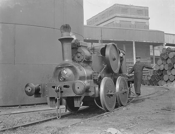 Mr F Tremain and Mr A Shoveller operating an old locomotive in Erith, London. 1939