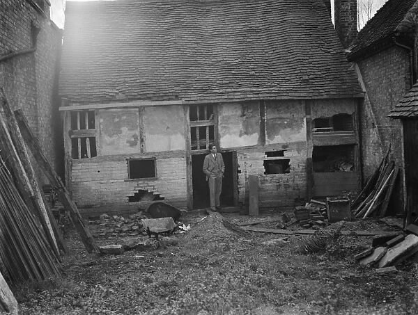 Mr Greenfield at an old dilapidated cottage, wich is to be used as a museum in Eynsford
