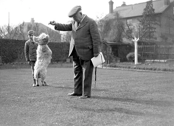Mr Hammond making a dog jump in Sidcup, Kent. 1934