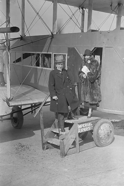 Mr Robert Courrneidge and his wife before leaving Croydon aerodrome on a flight to