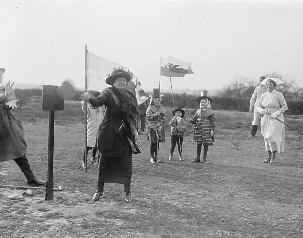 Mrs Lloyd George plays stoolball at Chailey. 13 March 1921