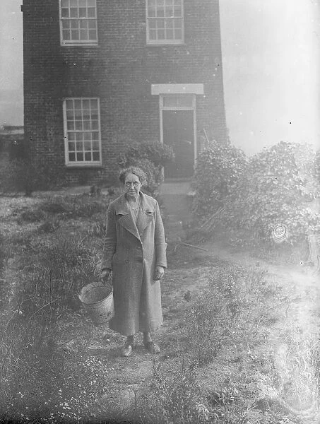 Mrs A Peck of Northfleet with her tin bucket. 7 March 1938