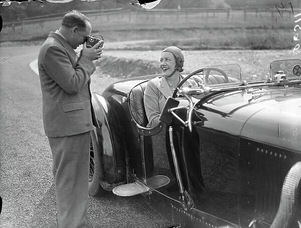 Mrs Roy ( Marjorie ) Eccles being filmed by her husband before racing on the track