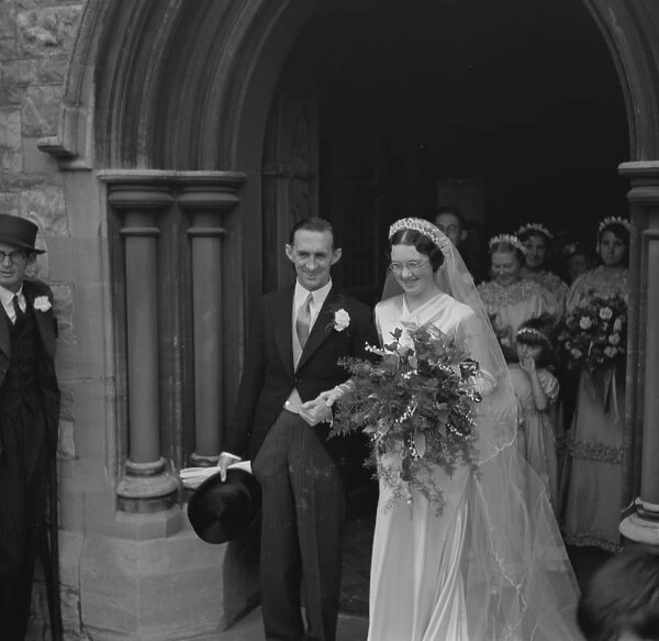 An old fashion wedding at Eltham Parish church. The bride and groom leaving the church