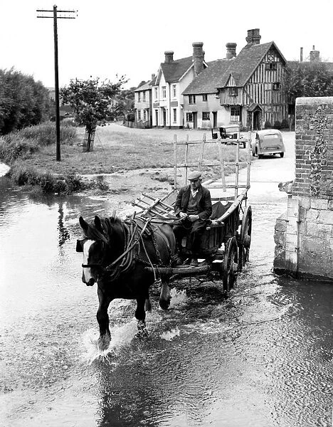 Old man driving through the ford at Eynsford in a horse and cart. Between the wars