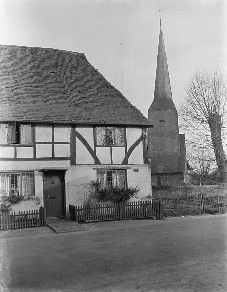 Old timber cottage and a church in Cowden, Kent. 1937