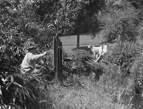Painting and fishing in the gardens of Oakhill. 1928