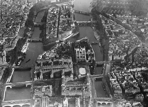 Paris as seen from the air. Showing in the foreground, the Ile de la Cite with Notre Dame