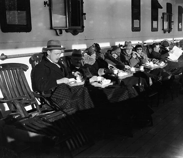 Passengers enjoy some tea on deck aboard the ocean liner, RMS Adriatic of the White