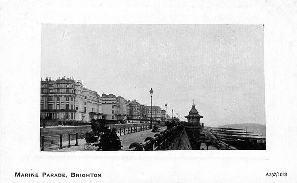 Some people gathered at the seafront, Marine Parade, Brighton, East Sussex, England