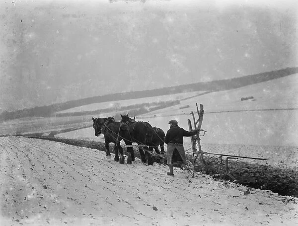 Ploughing in snow on a field in Sevenoaks, Kent. 1937