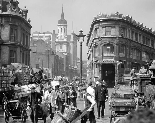 A policeman walks his beat with the fish porters, traders and barrow boys in Billingsgate