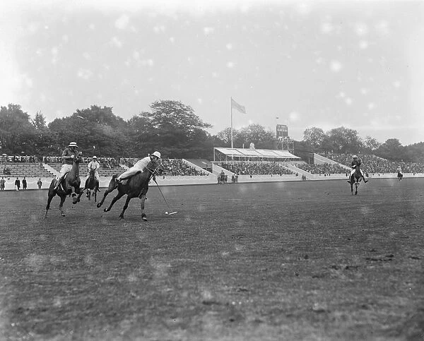 Polo at the Hurlingham Club - one of the players clearing his goal. 1921